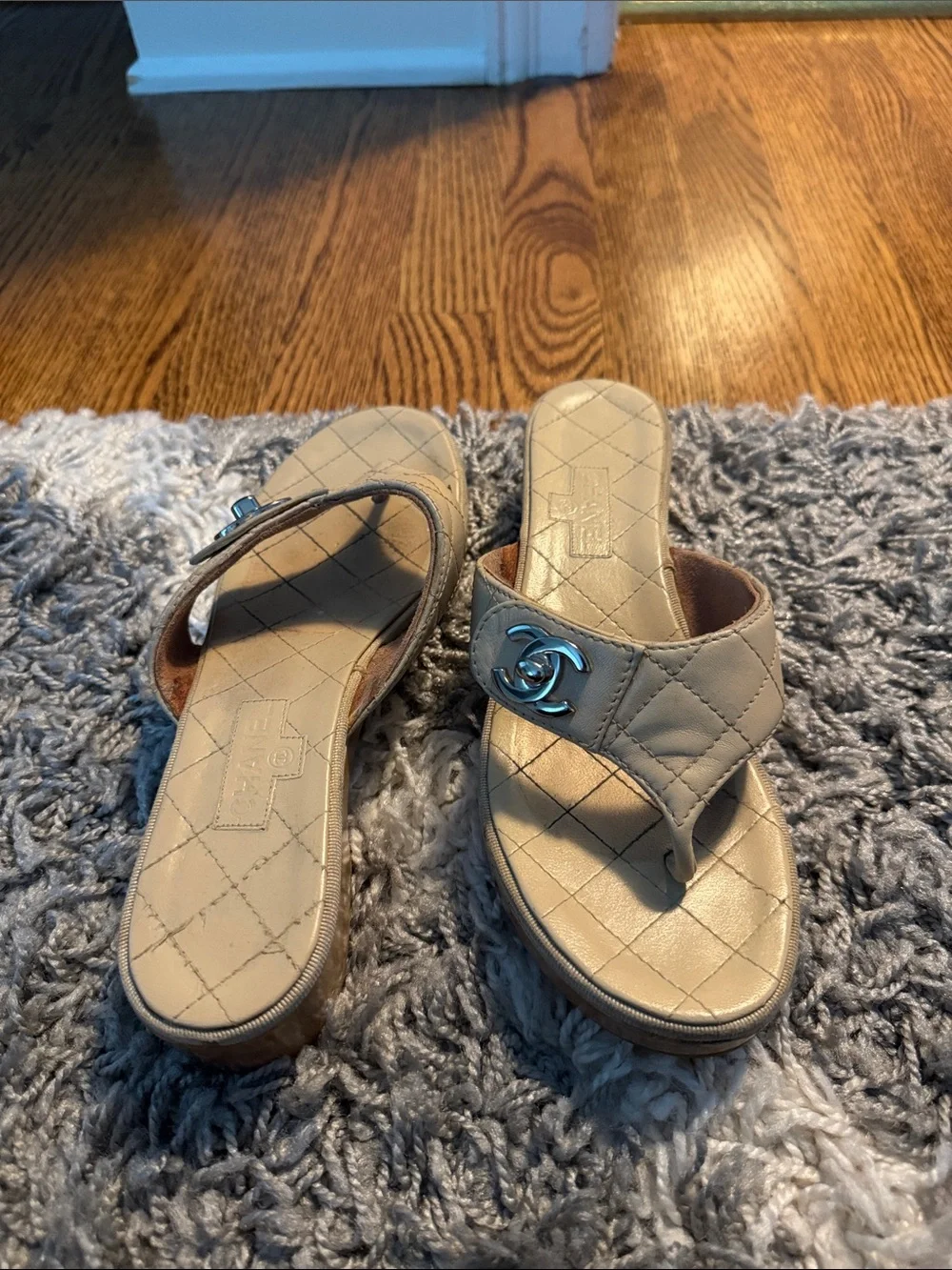 CHANEL Cream Quilted Leather Slide Mules with Logo Accent